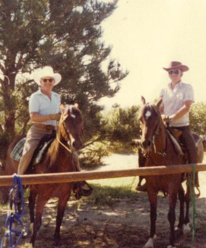 Grandpa and Dad on horses